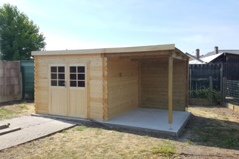 Light wooden storage shed with a double door and small-pane window, in a fenced backyard.